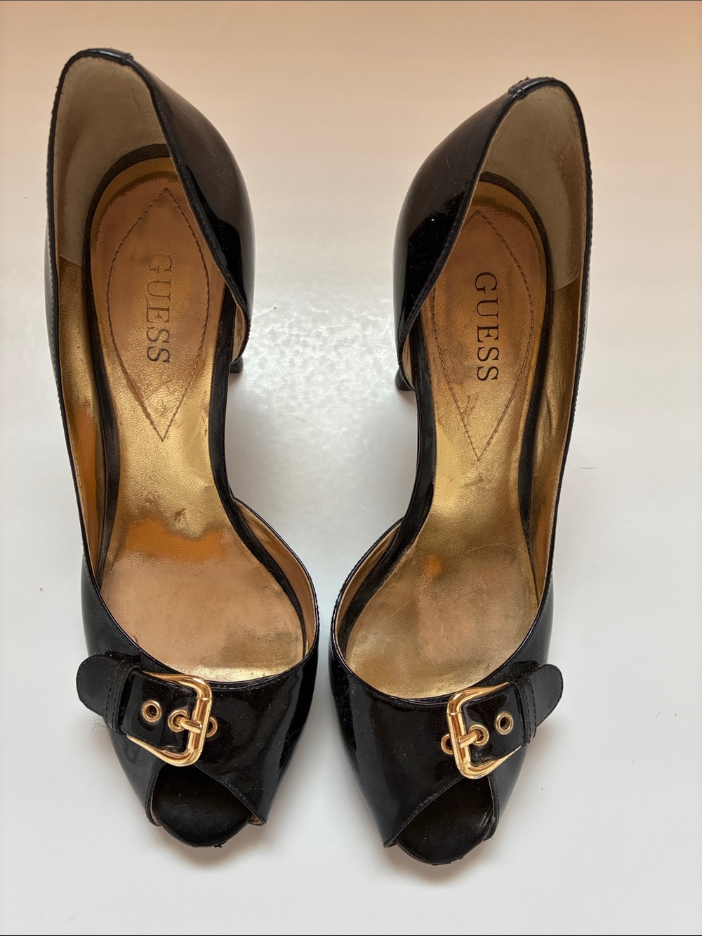 GUESS Black Patent Peep-Toe Heels with Gold Buckle Accent